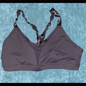 Ascudds black born primitive sports bra, size large.